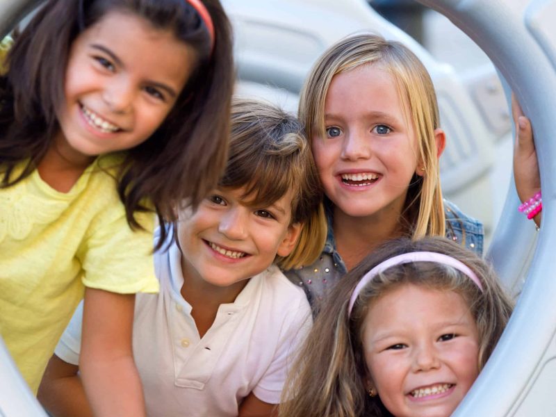 Portrait of group of childrens having fun in the park.